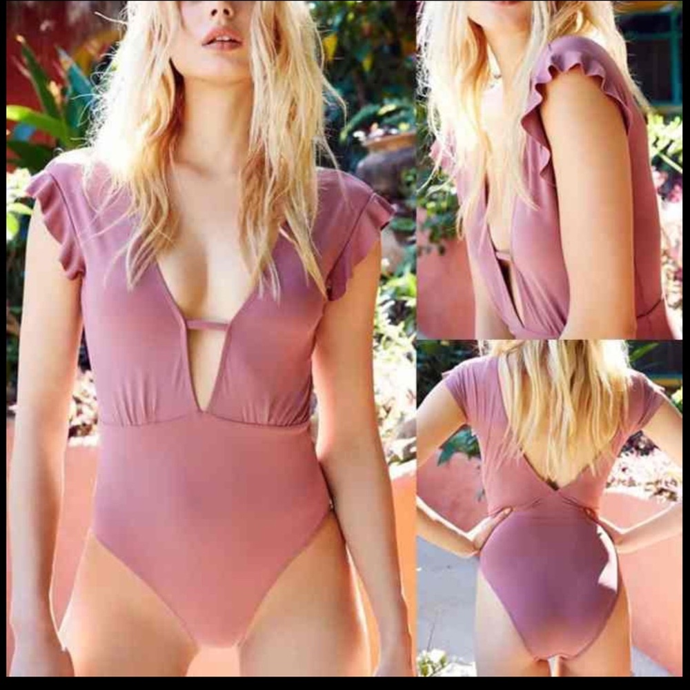 Mauve pink one piece swim suit w/ low cut front & back & cute ruffle sleeves.